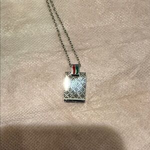 Elegant Silver Necklace with Red and Green Accents